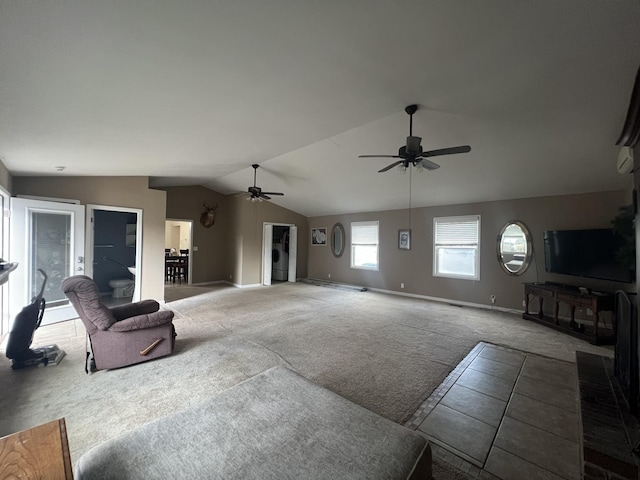 living room with carpet floors, vaulted ceiling, and ceiling fan