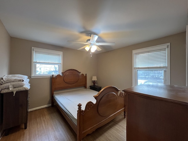 bedroom featuring wood-type flooring and ceiling fan