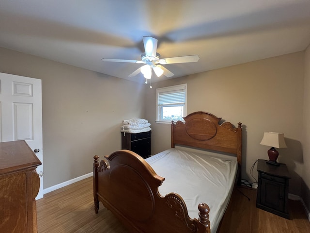 bedroom with ceiling fan and hardwood / wood-style floors