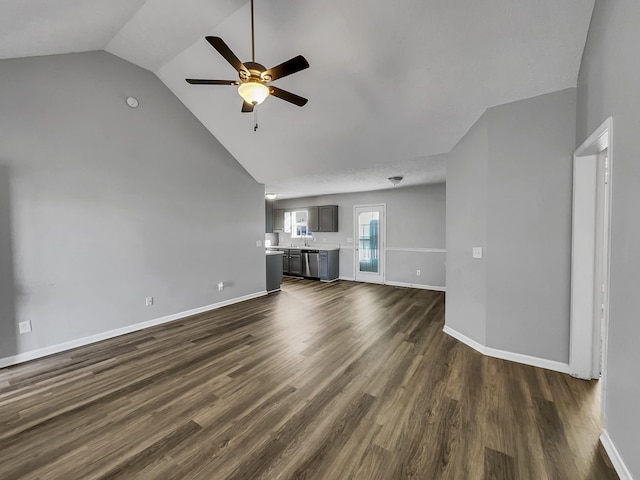 unfurnished living room with dark wood-type flooring, ceiling fan, and lofted ceiling