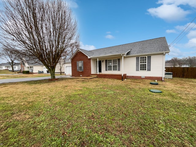 ranch-style house with a garage and a front yard