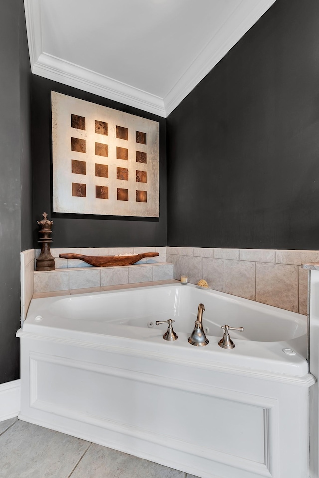 bathroom featuring tile patterned flooring, crown molding, and a tub