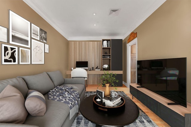 living room featuring hardwood / wood-style flooring and crown molding