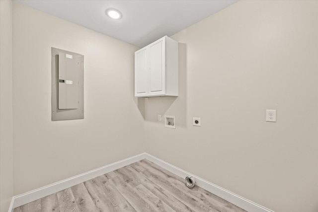 laundry room with electric dryer hookup, cabinets, electric panel, hookup for a washing machine, and light wood-type flooring