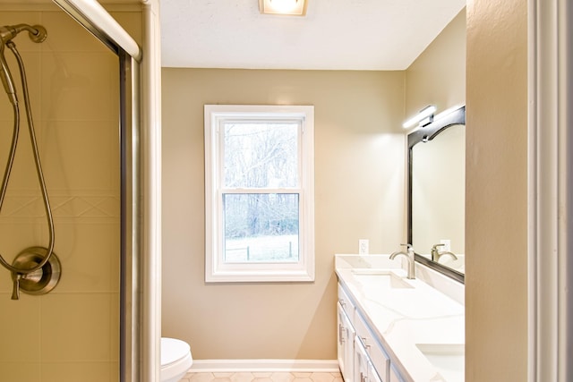 bathroom featuring tile patterned flooring, plenty of natural light, toilet, and a shower with shower door