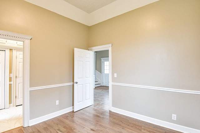 spare room with light wood-type flooring