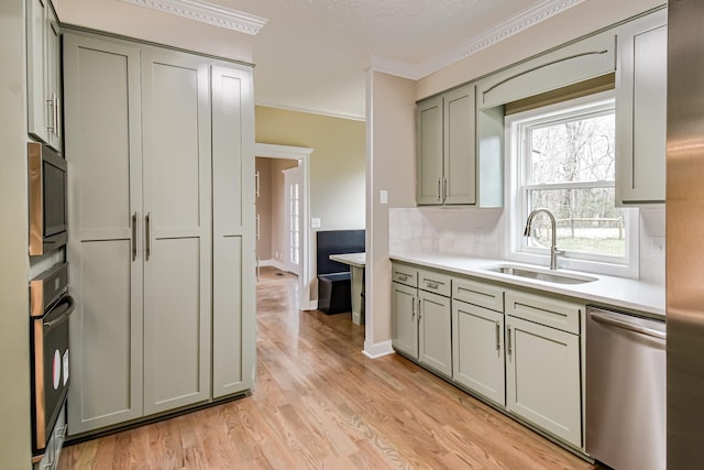 kitchen with backsplash, sink, stainless steel dishwasher, built in microwave, and black oven