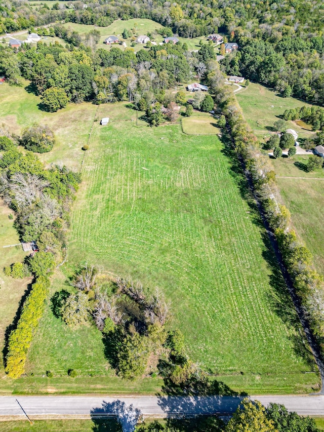 birds eye view of property featuring a rural view