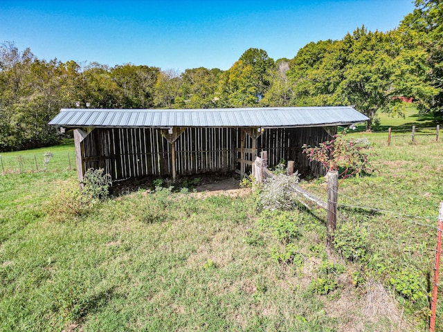 view of outdoor structure with a rural view