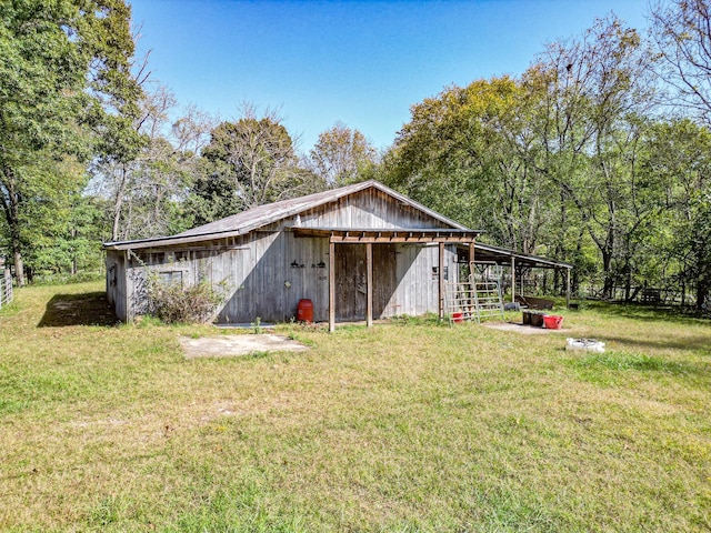 view of outdoor structure with a yard