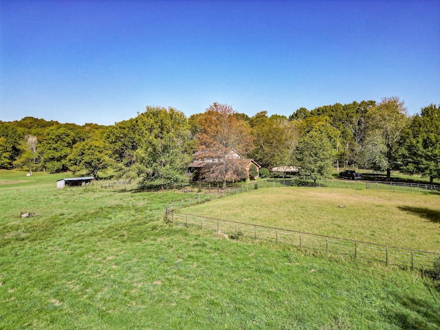 view of yard with a rural view