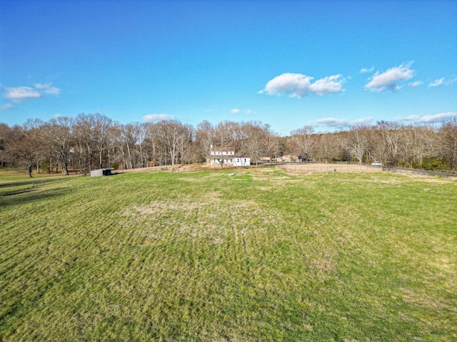 view of yard with a rural view