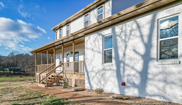 view of home's exterior with covered porch