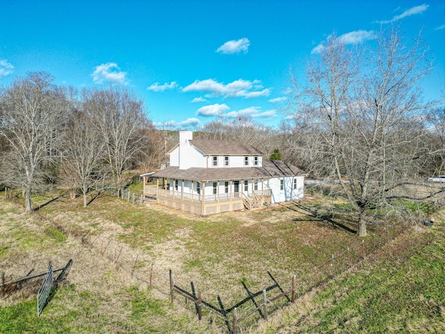 rear view of house with covered porch