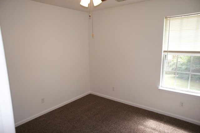 empty room with ceiling fan and carpet floors