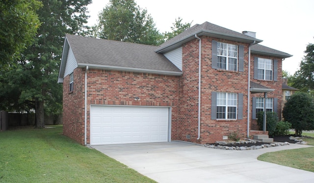 view of front facade with a front yard and a garage