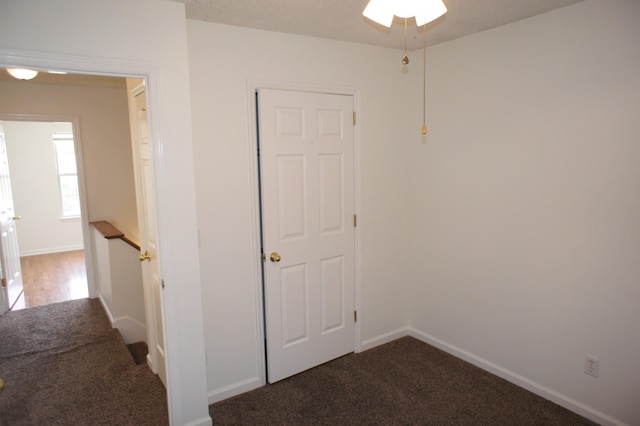 corridor with carpet flooring