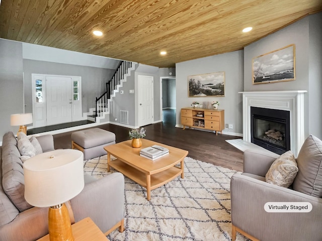 living room featuring light hardwood / wood-style flooring and wood ceiling