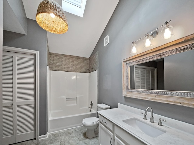 full bathroom with lofted ceiling with skylight, vanity, shower / bath combination, and toilet