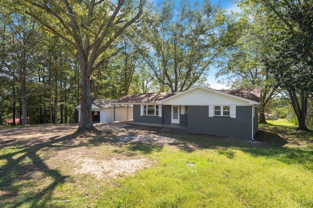 single story home with a garage and a front yard