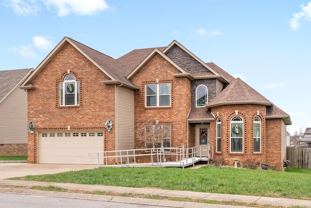 view of front of property featuring a garage and a front lawn