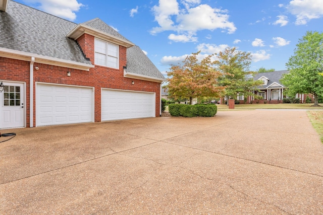 view of side of property with a garage