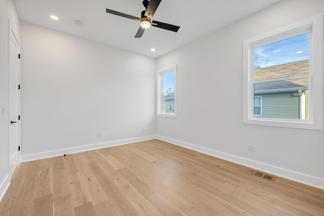 empty room featuring light wood-type flooring and ceiling fan