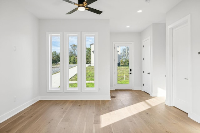 entryway with light hardwood / wood-style floors and ceiling fan