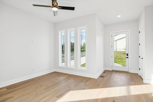 foyer with light wood-type flooring and ceiling fan