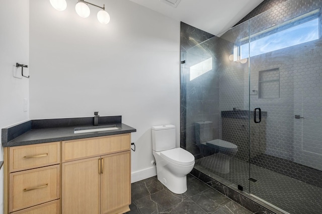 bathroom with vanity, toilet, walk in shower, and vaulted ceiling