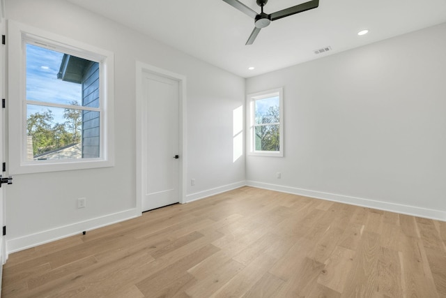 unfurnished room with ceiling fan and light hardwood / wood-style flooring