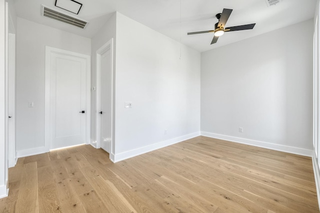 empty room with ceiling fan and light wood-type flooring