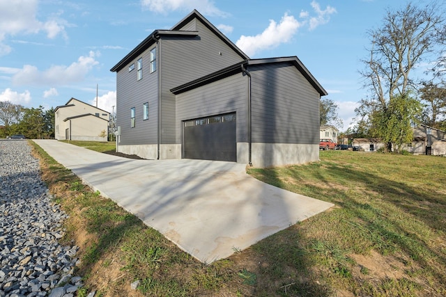 view of property exterior featuring a yard and a garage