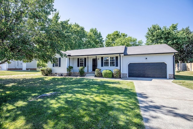 ranch-style house featuring a front lawn and a garage