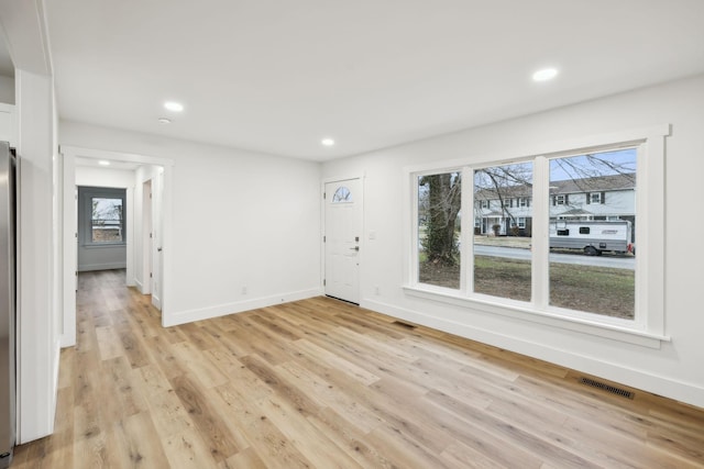 unfurnished room featuring light hardwood / wood-style floors