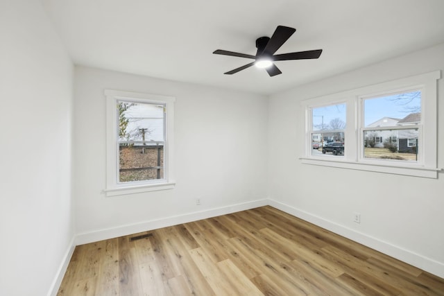 unfurnished room featuring ceiling fan and light hardwood / wood-style flooring