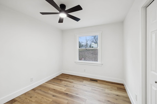 spare room featuring ceiling fan and light wood-type flooring