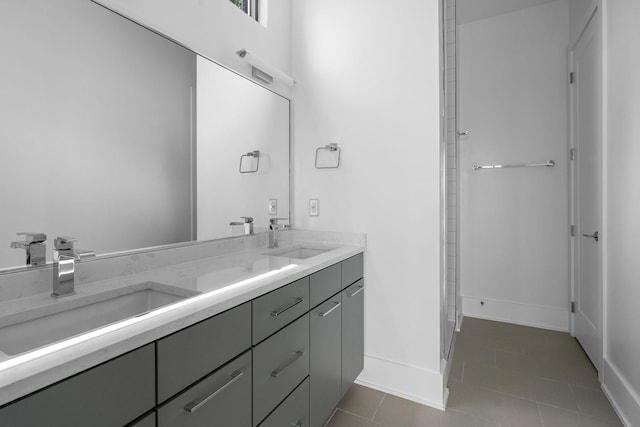 bathroom with tile patterned floors and vanity