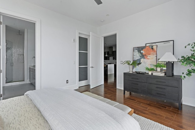 bedroom featuring ceiling fan, dark hardwood / wood-style flooring, and ensuite bath