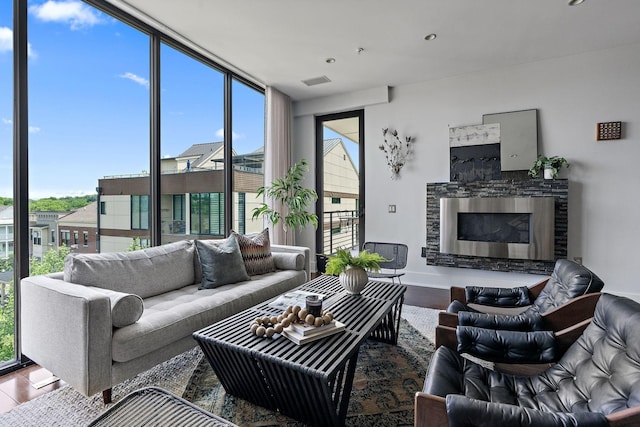 living room with hardwood / wood-style floors and expansive windows