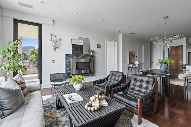 living room featuring a fireplace and an inviting chandelier