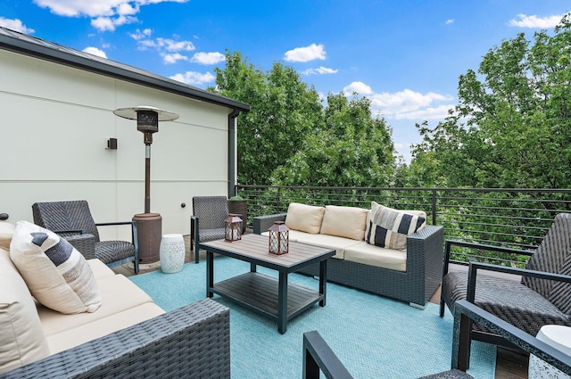 view of patio with a balcony and an outdoor hangout area