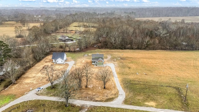 aerial view with a rural view and a wooded view