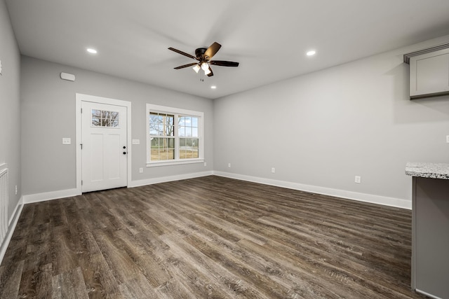 interior space with recessed lighting, baseboards, and dark wood-style flooring