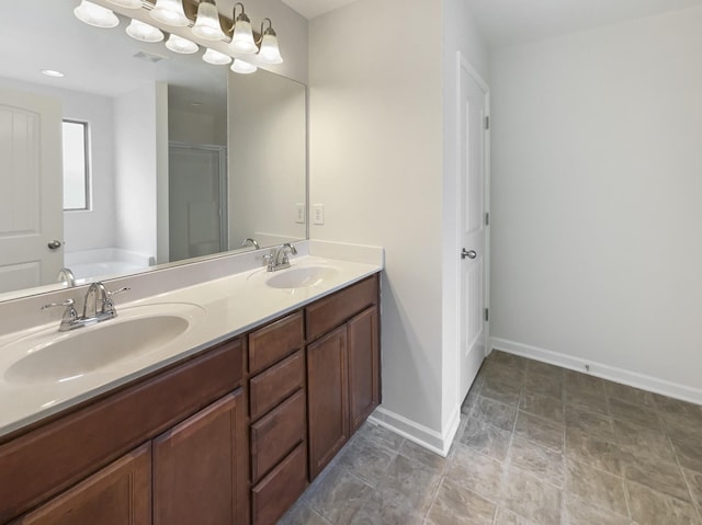 bathroom with a bathing tub and vanity