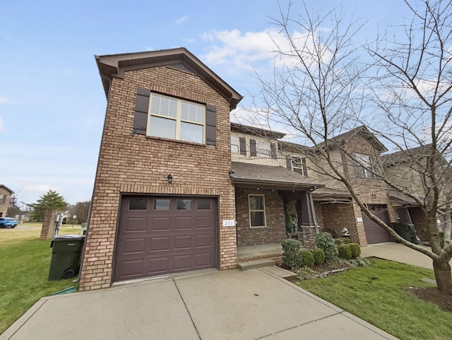 view of front of home with a front yard and a garage