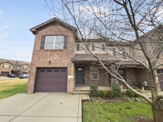 view of front of property featuring a garage and a front lawn