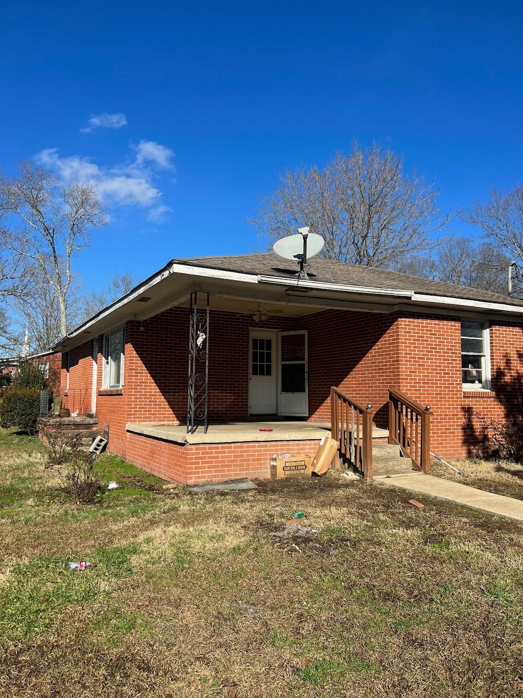 back of house with a yard