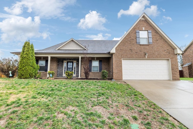 view of front of house with a garage and a front yard