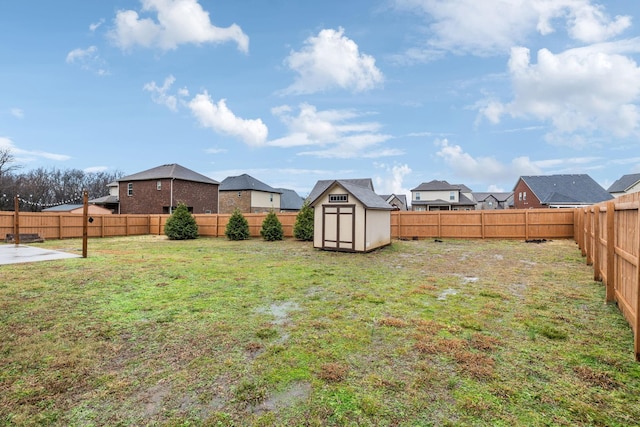 view of yard with a storage unit